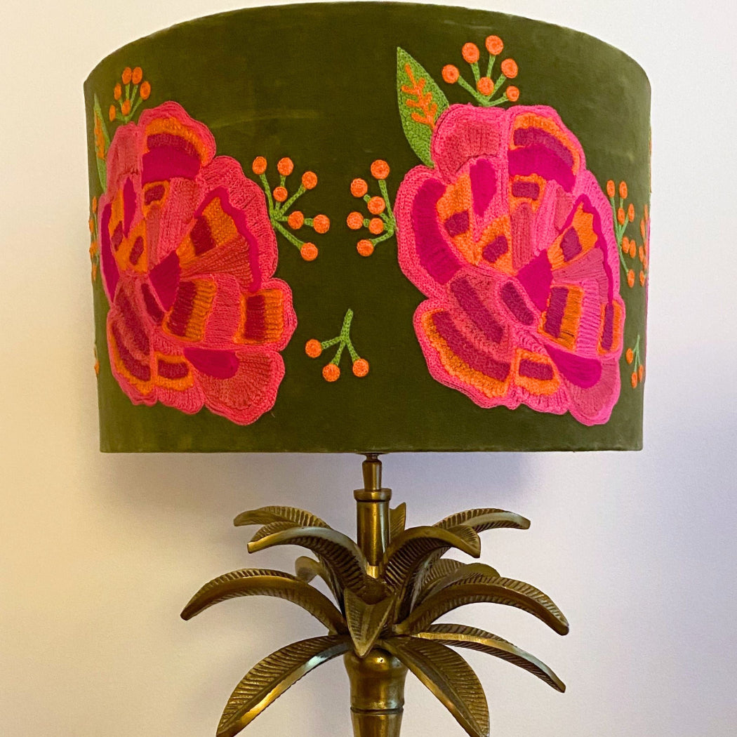 Elegant green velvet lamp shade featuring pink ranunculus flowers, perfect for enhancing interior aesthetics.