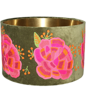 Green velvet drum lamp shade adorned with pink ranunculus flowers, adding a vibrant touch to any decor.